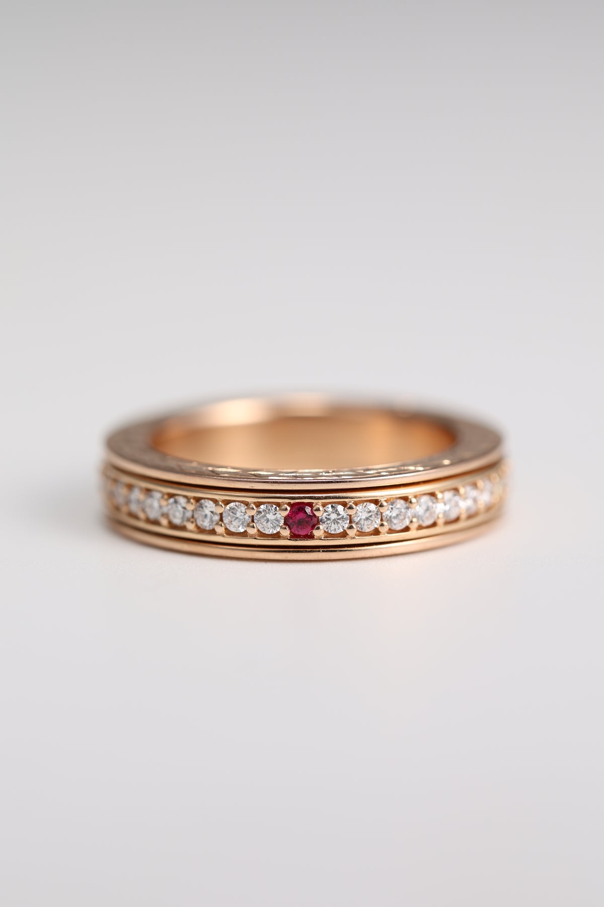 18K rose gold ruby and diamond spinner ring, front view
